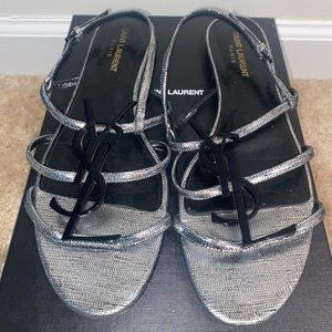 YSL silver sandals with black YSL metal.